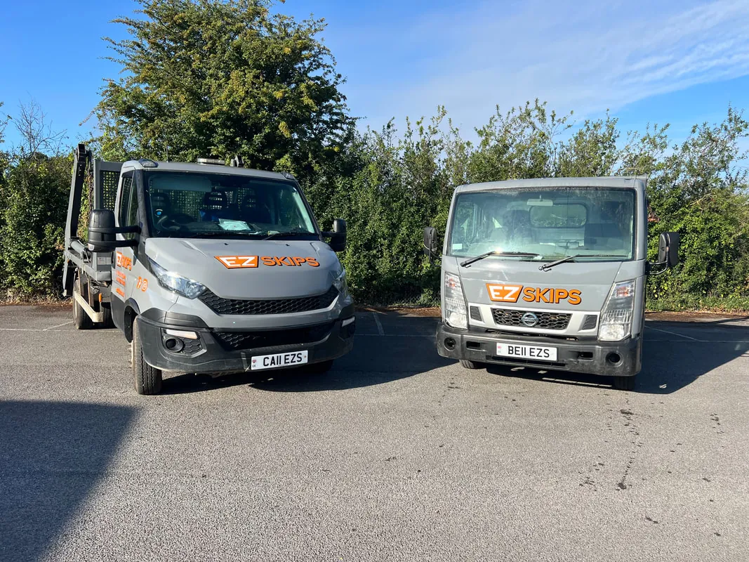 Two EZSKIPS lorries parked side by side